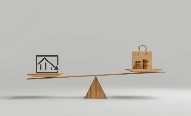 scale with declining graph on one side and money with a shopping bag on the other side